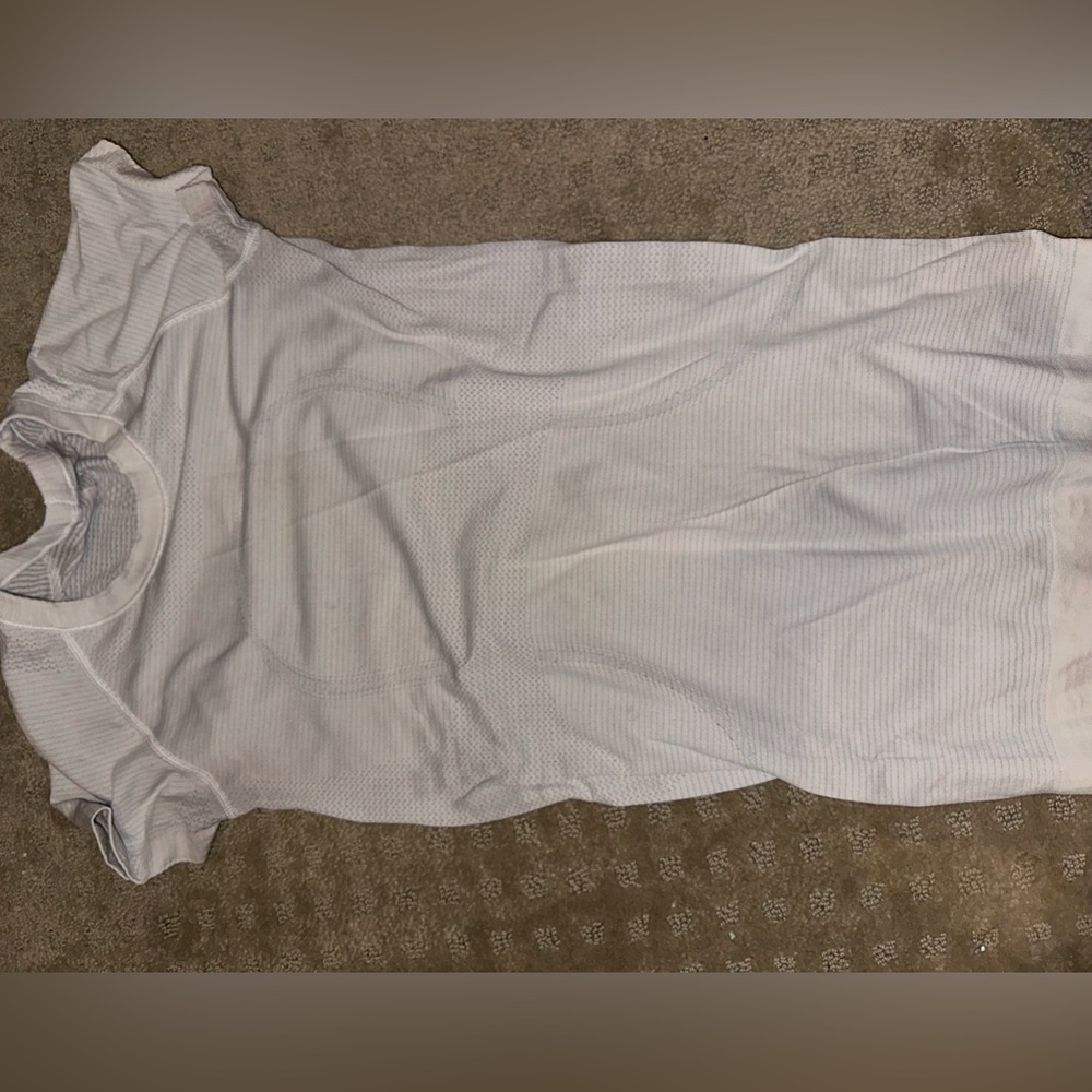 White lulu top small light colored stain at top